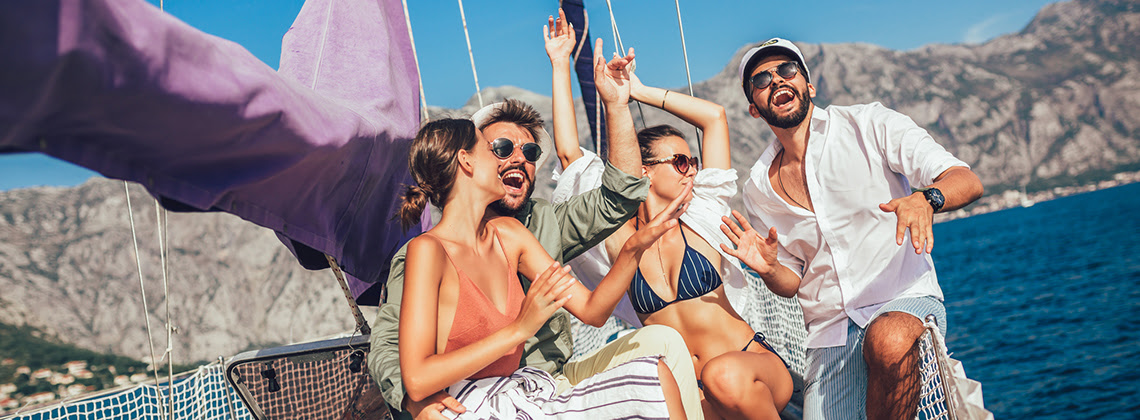 People dance to music on a yacht